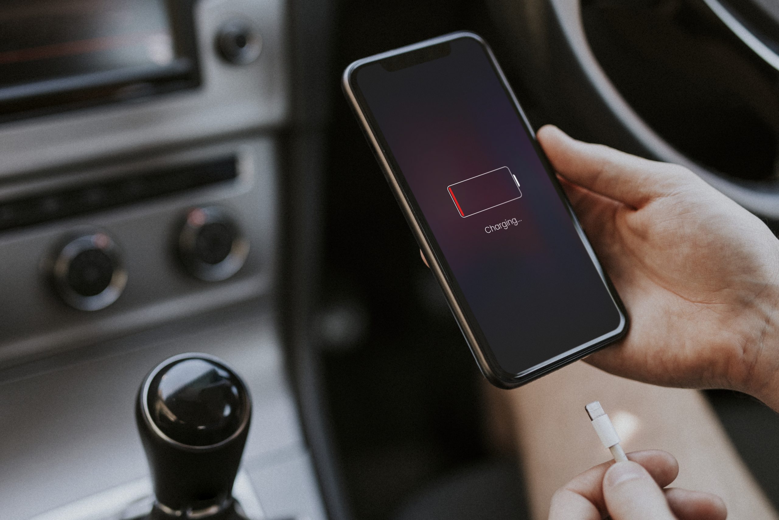 Smartphone charging via cable in a car