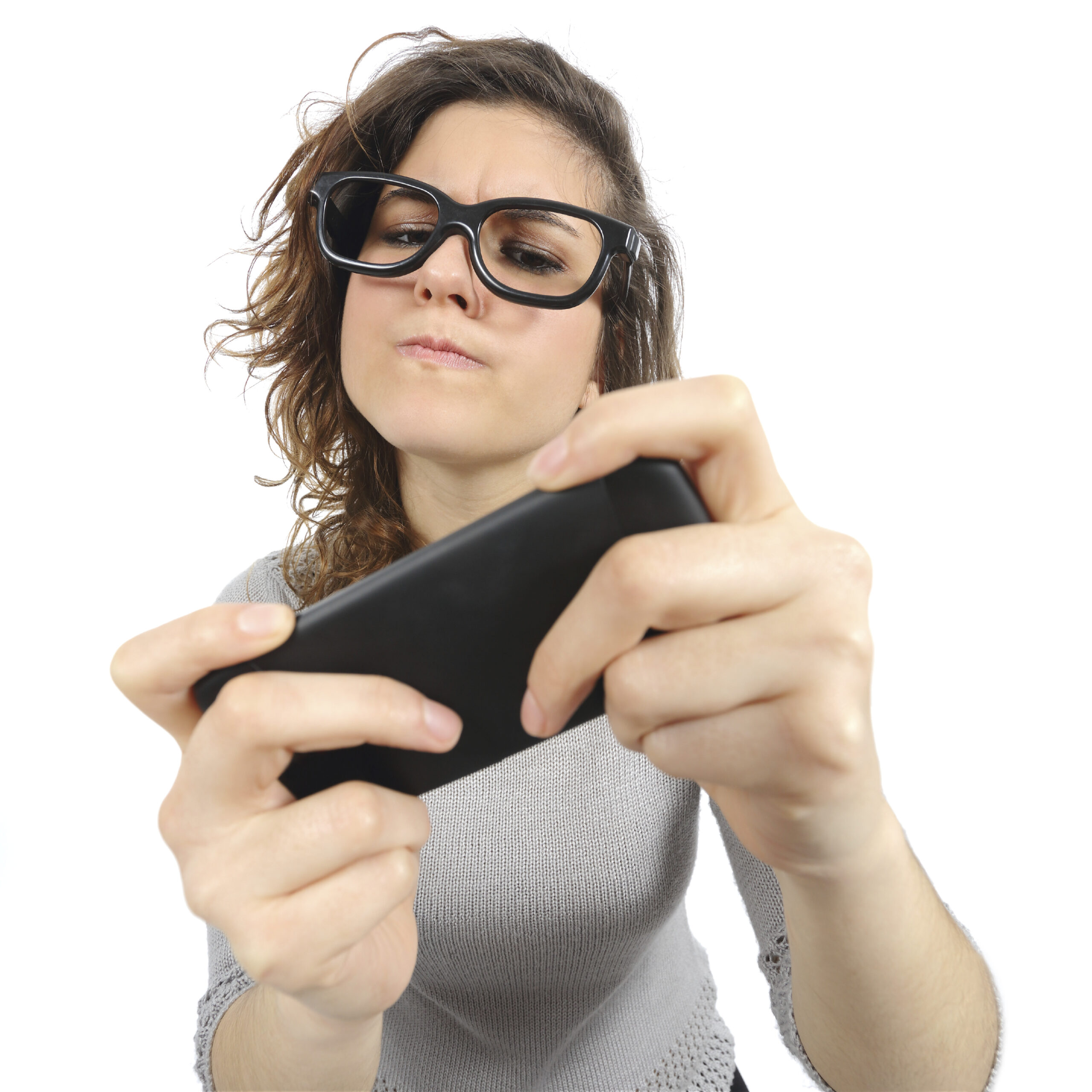 Geek woman playing with a smart phone isolated on a white background
