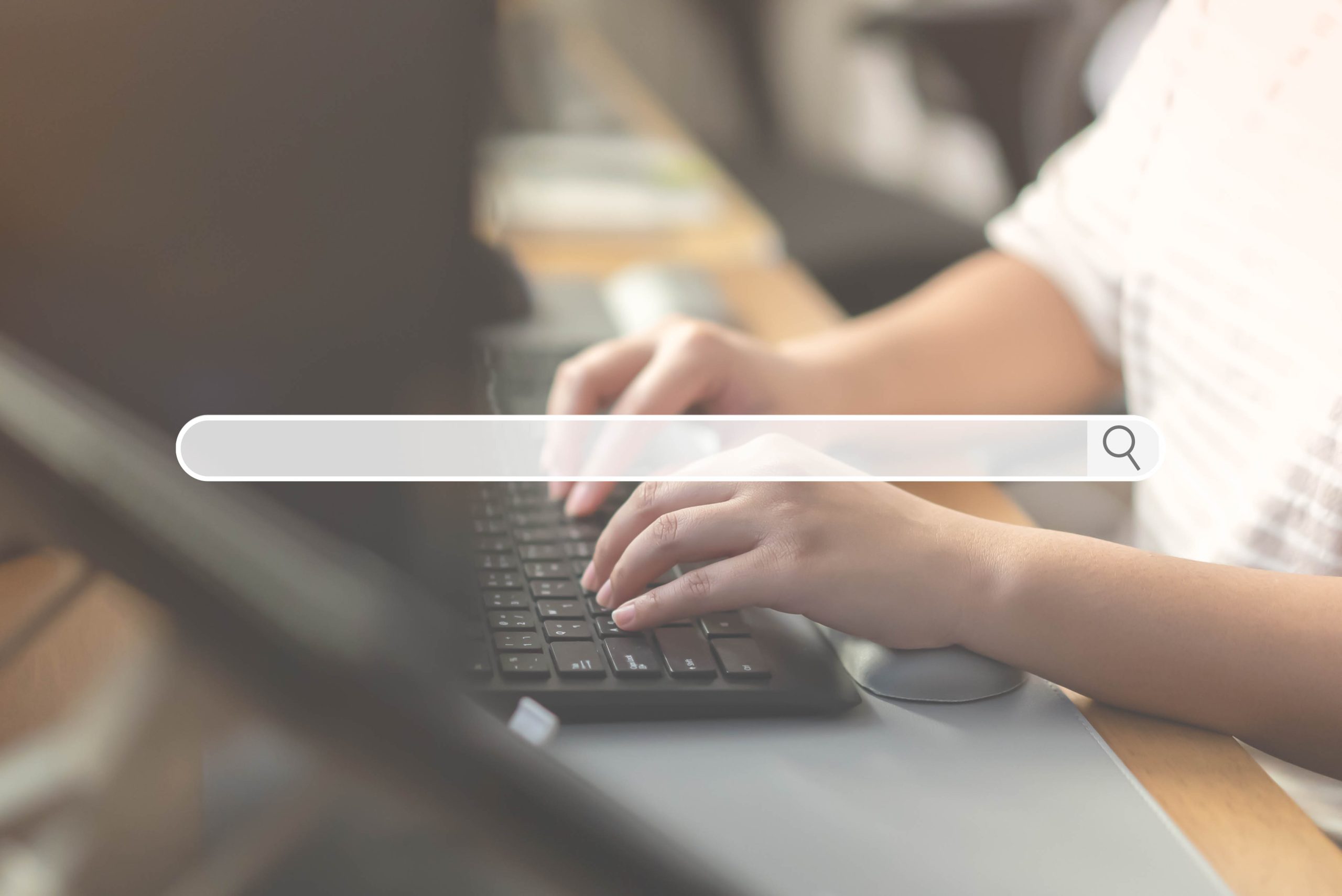 Close up of human hand typing on computer keyboard as background